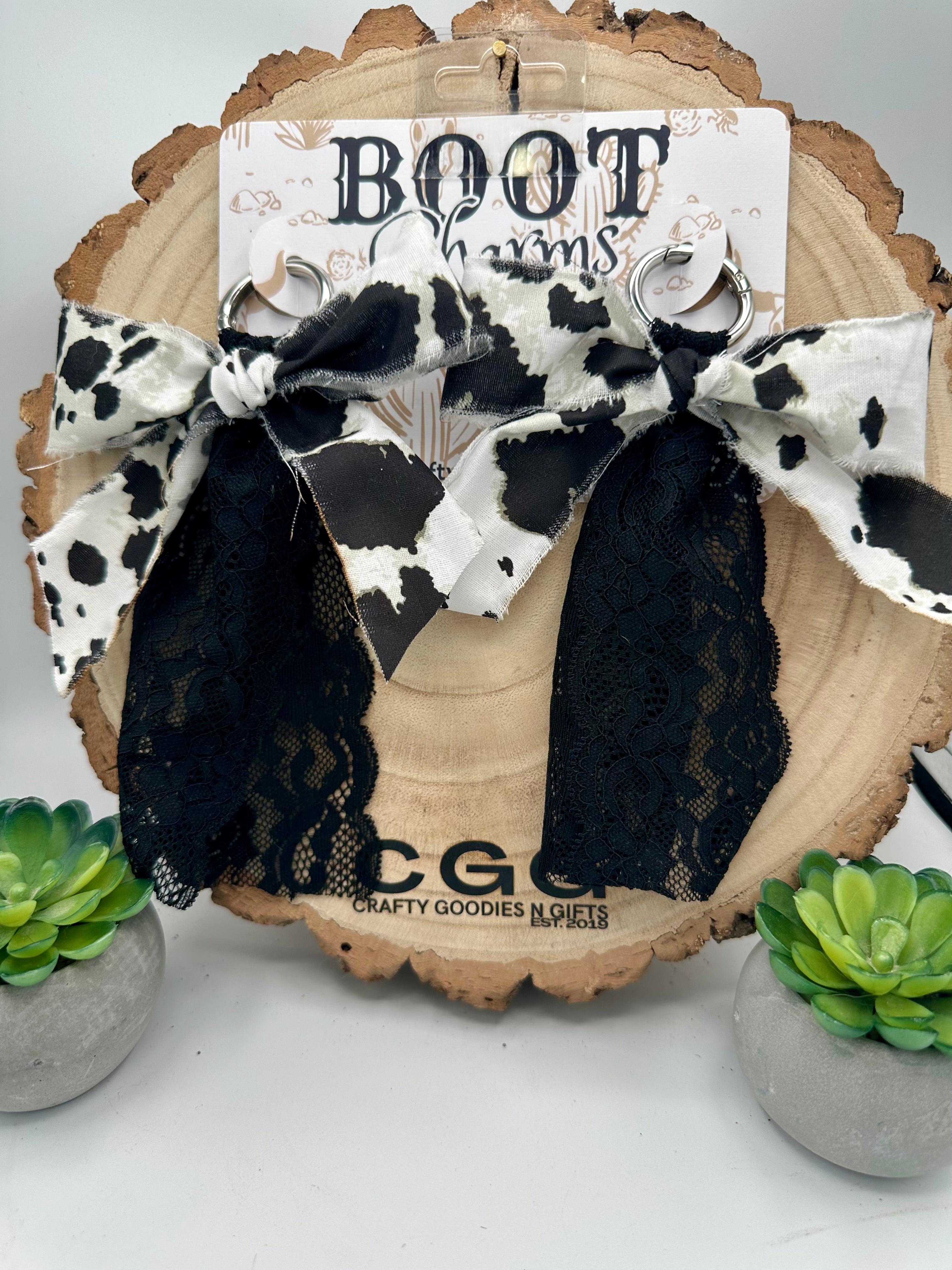 Boot Charms Made from a black and white cow print ribbon bow with black lace trim, .