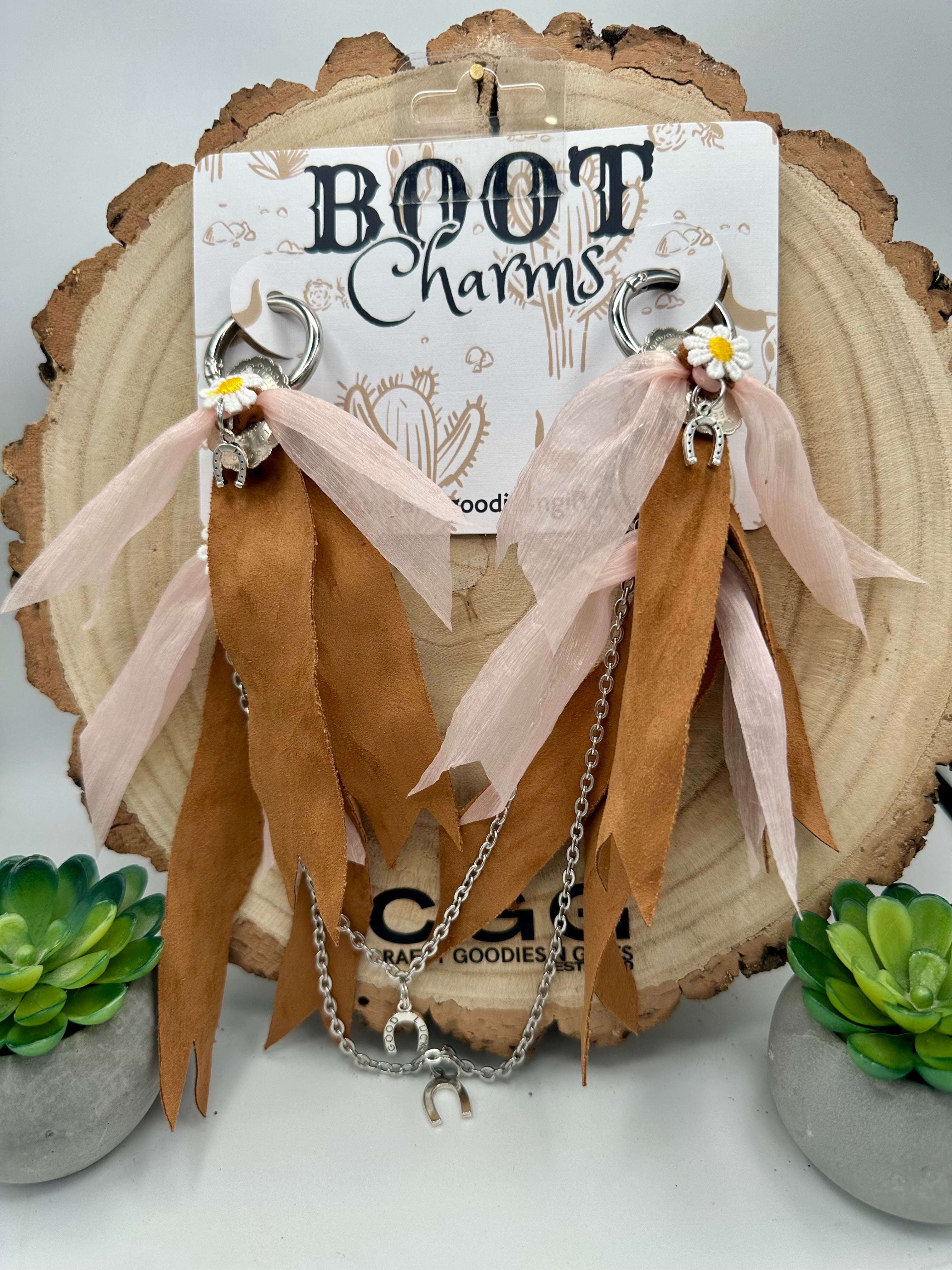 Boho-style Boot Charms featuring silver hoop rings, silver chains, tan faux-suede ribbon strands, blush pink sheer ribbon strands, small white daisy charms, and silver horse charms.