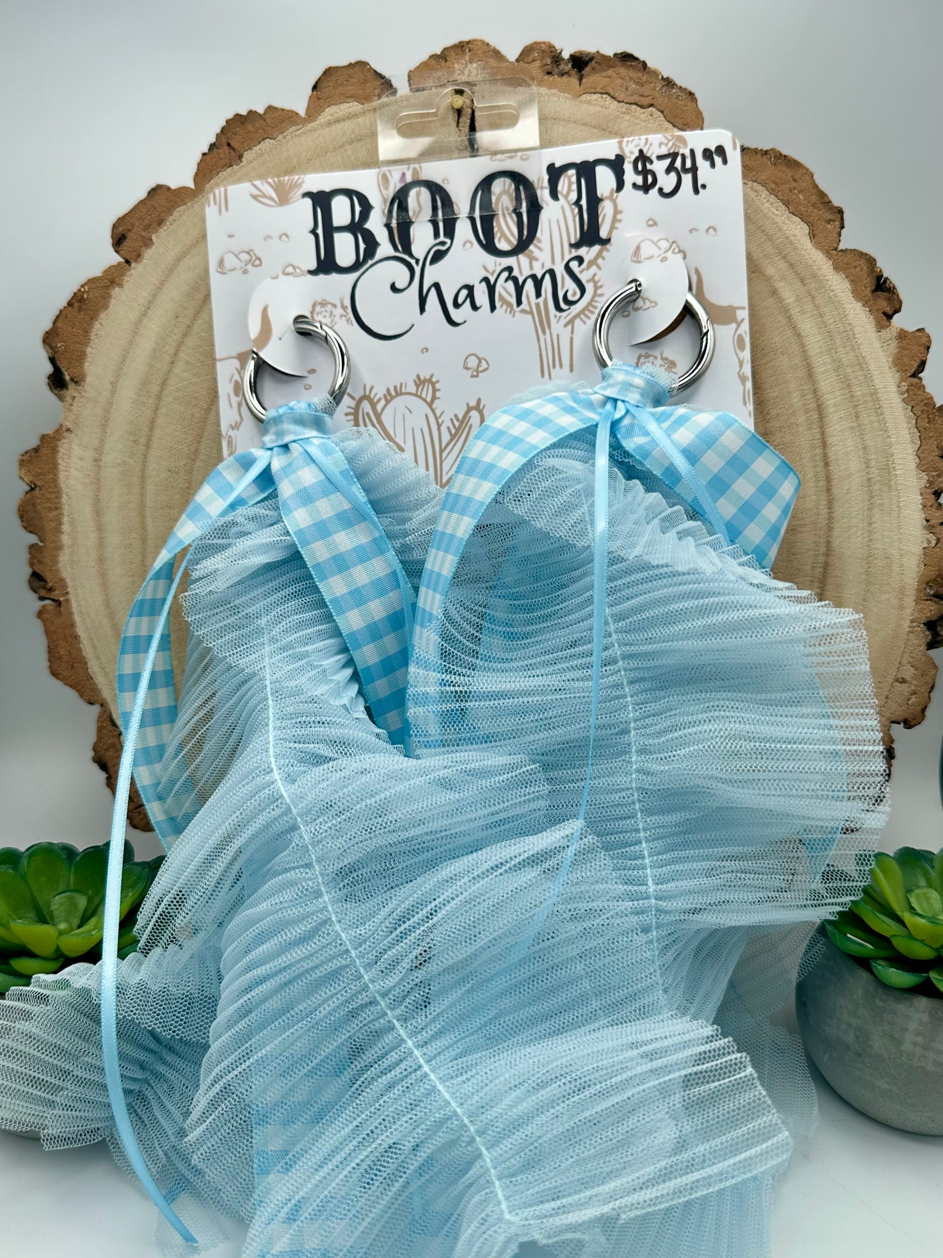 A pair of light blue and white gingham ribbon boot charms with layered ruffled tulle.