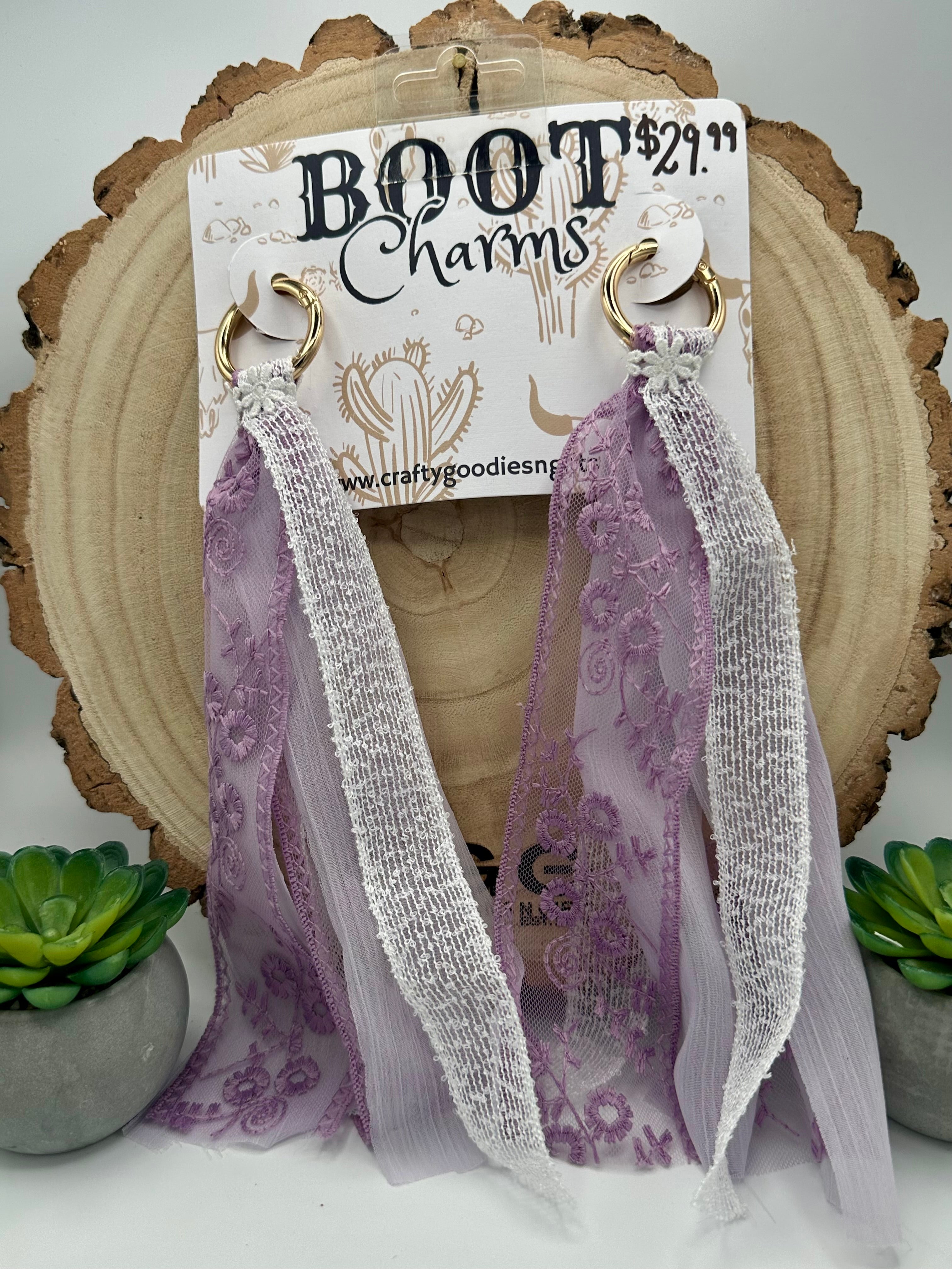 A pair of dangling tassel boot Charms. Featuring Gold rings and long sheer lavender lace and mesh tassels.