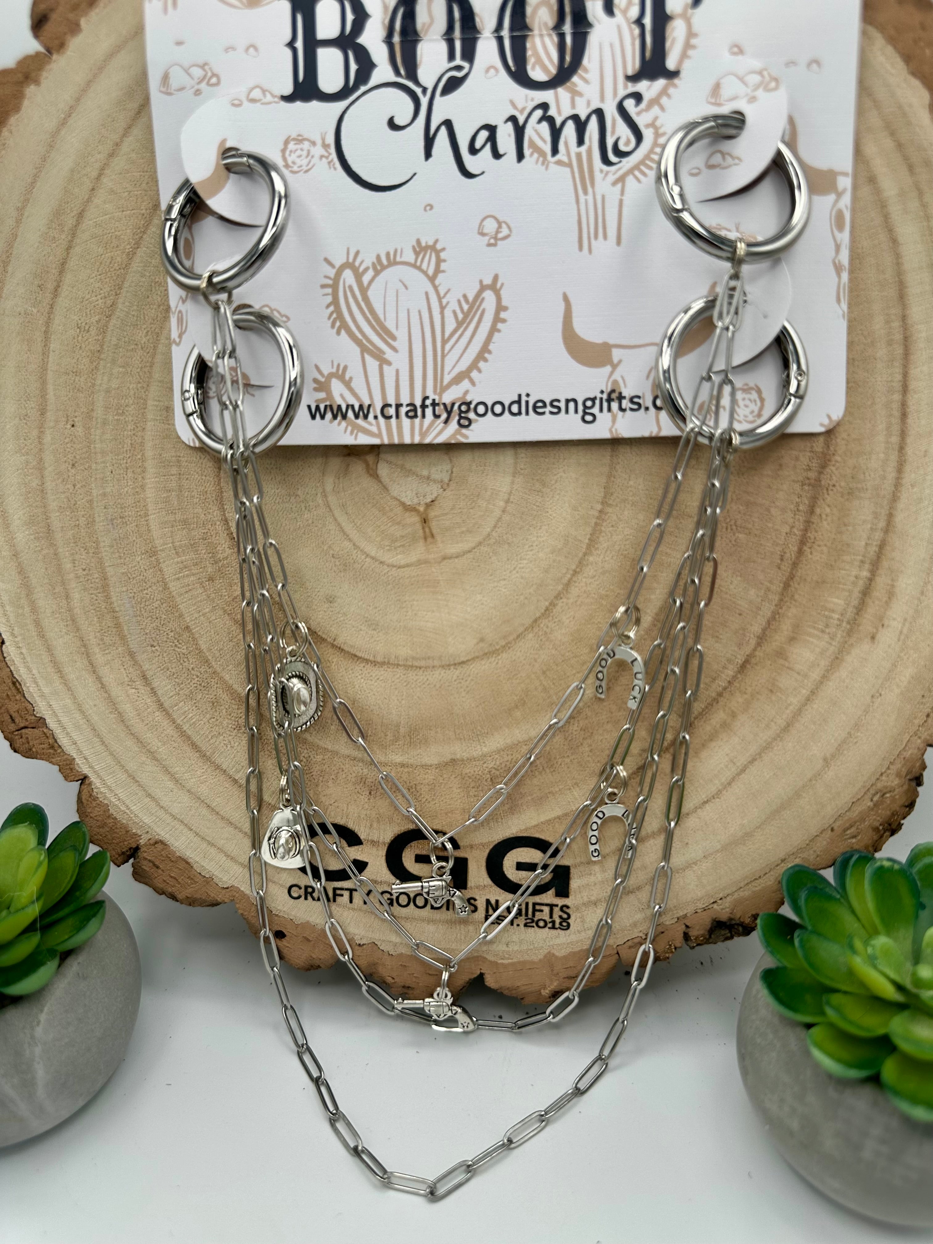 Silver double-ring chain boot charms with multiple draped chains.