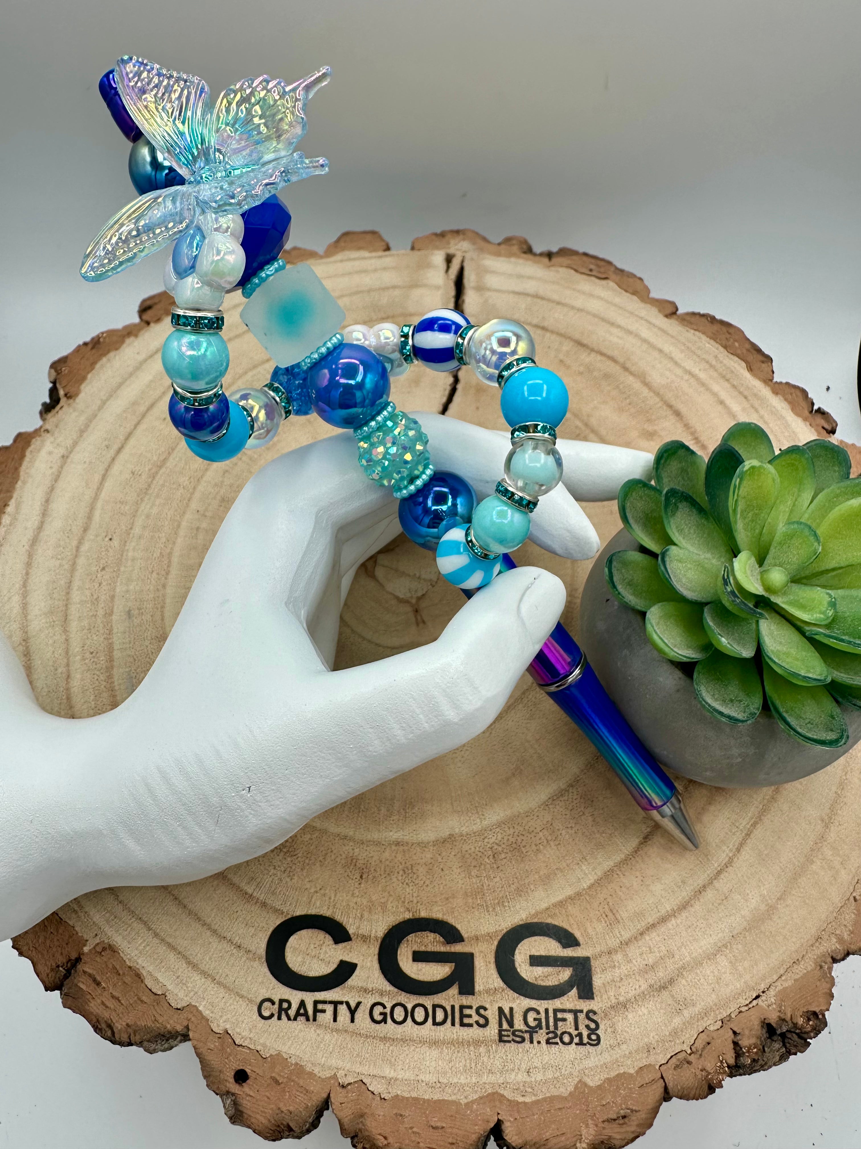 Blue beads and Butterfly topper on extended bar 